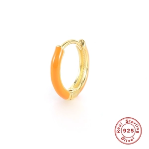 Macro detail of S925 sterling silver hallmark on orange enamel gold hoop earring