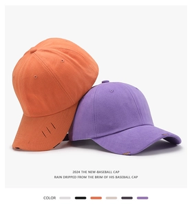 Detail of distressed brim and 6-panel structure on a cotton canvas baseball cap