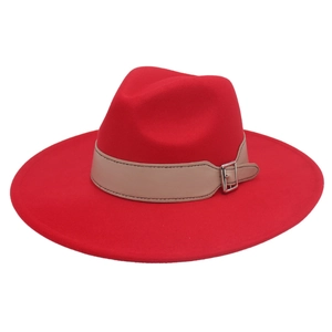 Detail of red wide-brim fedora hat featuring a beige leather belt and silver metal buckle