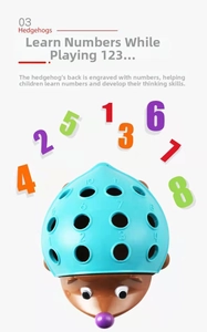 Macro shot of educational hedgehog toy shell with numbered slots for motor skill training