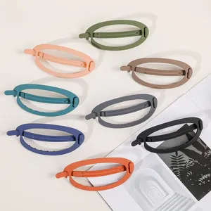 Detailed overhead view of large matte frosted oval hair claws in eight assorted colors