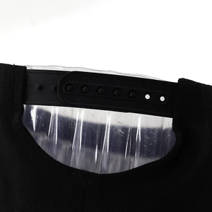 Detail of adjustable snapback closure on black cotton baseball cap with plastic strap