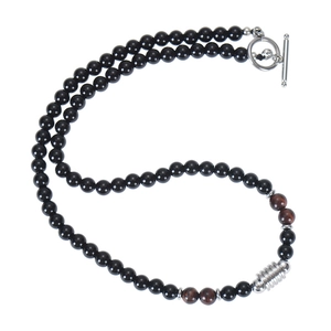 Detail of 6mm tiger eye and black agate beaded necklace with silver toggle clasp closure