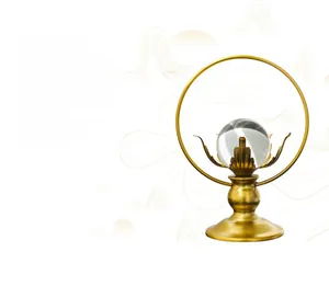Detail of crystal ball ornament with gold lotus base on a modern Zen circular stand