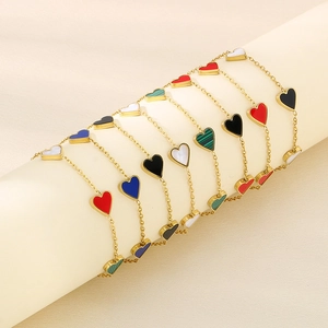 Collection of golden heart charm bracelets in red black white blue and green colors