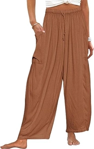Détail de la taille élastique à cordon et des grandes poches sur ce pantalon sarouel en lin