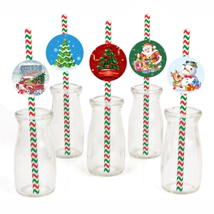 Detailed view of Christmas paper straws with festive snowman and Santa decorative cards