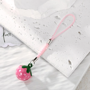Detail of pink strawberry bell pendant with green leaf and woven lanyard strap