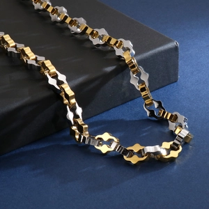 Detail of high-polish gold and silver bicolor geometric chain necklace for men