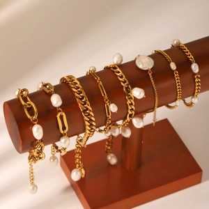Gold stainless steel Figaro and Cuban link bracelets with natural freshwater pearls