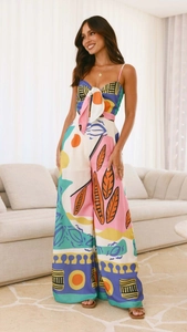 Detail of vibrant floral digital print jumpsuit with front lace-up and wide leg trousers
