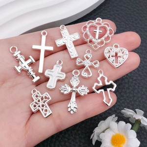 Set of ten silver cross pendants in various styles for DIY jewelry and necklaces