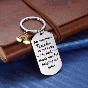 Rainbow teacher appreciation keychain on leather notebook for gift occasion