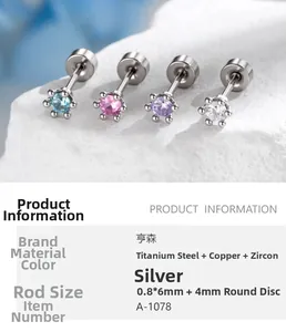 Close-up of 4mm screw back cartilage studs in titanium steel with zircon inlay