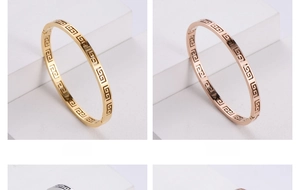 Detail view of Greek Key engraved bangles in gold, rose gold and silver stainless steel