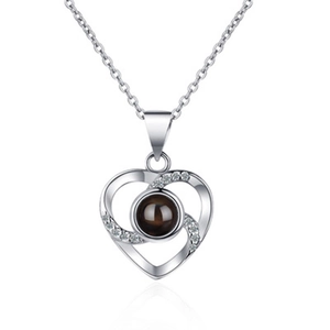 925 silver projection heart necklace with cubic zirconia on a white background