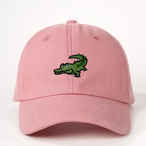 Pink adjustable cotton baseball cap featuring a green cartoon crocodile embroidery