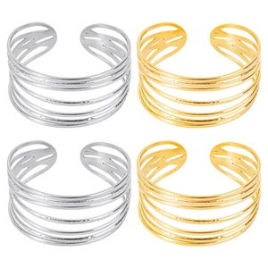 Detail of multi-layered open bangles in gold and silver finish with textured lines