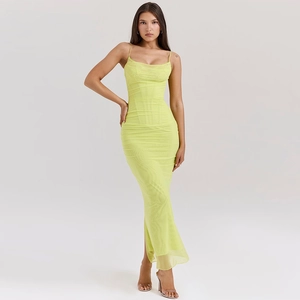 Full view of neon yellow mesh dress featuring ruched details and a bodycon slit design