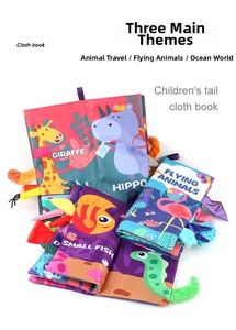 Detail of baby cloth books featuring 3D animal tails and educational patterns