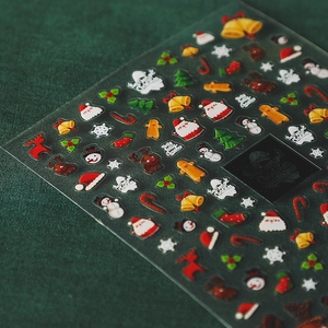 5D Christmas nail art stickers featuring Santa, snowman and reindeer designs on transparent sheet