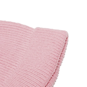 Detailed close-up of pink knit hat showing ribbed texture and soft yarn fabric