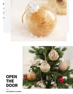Detail of 6cm clear Christmas ball ornaments with raffia filler on a snowy background