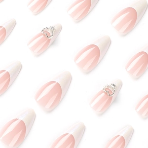 White French tip press-on nails with 3D silver hearts on a pink base, stiletto shape