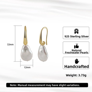 Detail view of S925 silver baroque pearl earrings with dimensions 32mm by 12mm