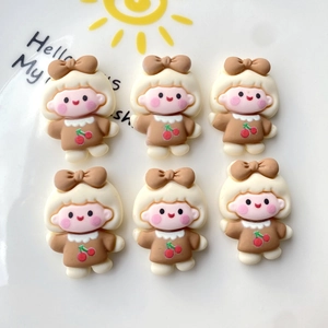 Detailed view of six cute cartoon girl resin charms with cherry dresses and brown hair