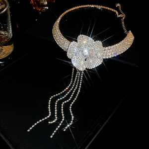 Detailed view of super shiny rhinestone camellia choker with sparkling long tassels