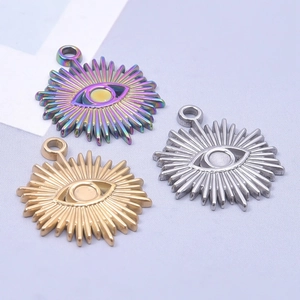 Three celestial sun evil eye pendants in rainbow, gold, and silver 18k plated finishes