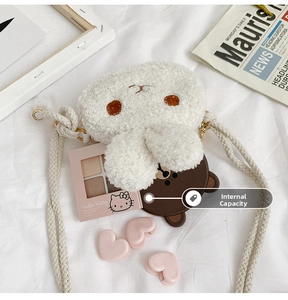 Internal capacity of the cute plush white bunny crossbody bag for kids with accessories