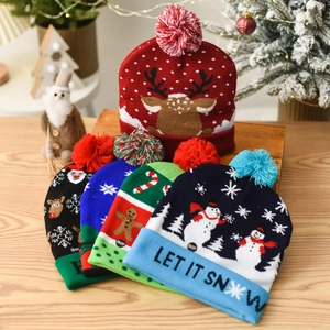 Knitted Christmas hats with colorful patterns and LED lights for festive holiday celebrations
