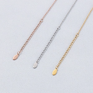 Close-up of adjustable extension chains in rose gold, silver, and gold stainless steel