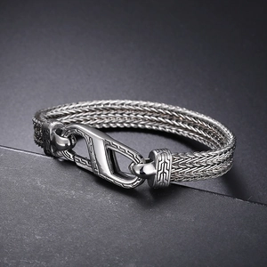 Vintage stainless steel braided chain bracelet with geometric pattern engraved buckle