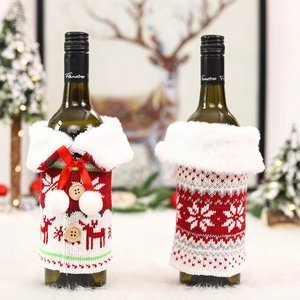 Christmas knit wine bottle covers with reindeer snow patterns and white faux fur collars