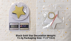 Detail of black and gold star garland set including glitter stars and gold ribbon roll