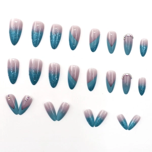 Blue glitter almond press-on nails with gradient finish and sparkling rhinestones