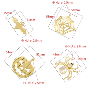 Golden Halloween pendant set featuring bat, spider web, pumpkin, and jeweled spider designs