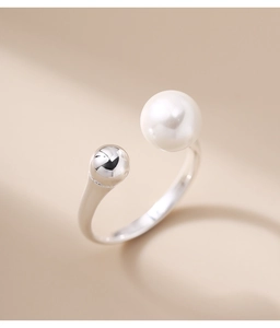 Detailed close-up of S925 sterling silver open ring with white pearl and silver bead