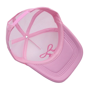 Detailed interior of pink mesh trucker hat showing adjustable strap and embroidery