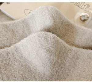 Close-up of thick, warm camel plush thermal socks with soft fuzzy texture for winter