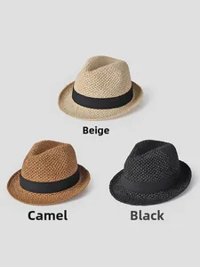 Flat lay of vintage straw fedoras in beige, camel and black with black ribbon bands