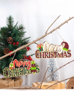 Detail of wooden Merry Christmas hanging signs with red and green plaid patterns