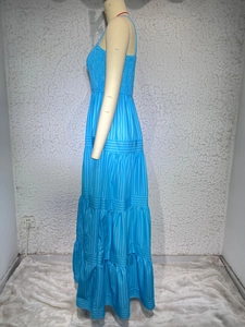 Detail of blue striped tiered maxi dress with spaghetti straps and smocked bodice