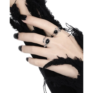 Irregular S925 sterling silver cross ring with black onyx stone on a gothic style hand