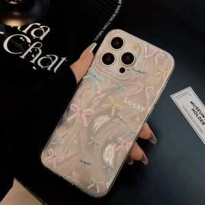 Close-up of pearl glitter iPhone case with colorful bows and Lucky text detail