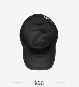 Detail view of black cap interior with breathable mesh lining and gold buckle