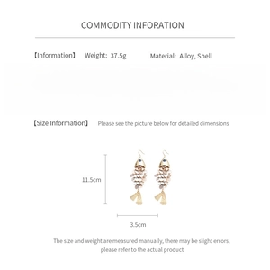 Detailed view of fish-shaped earrings with shell scales and size specifications